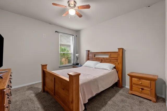 a view of walk in closet with clothes