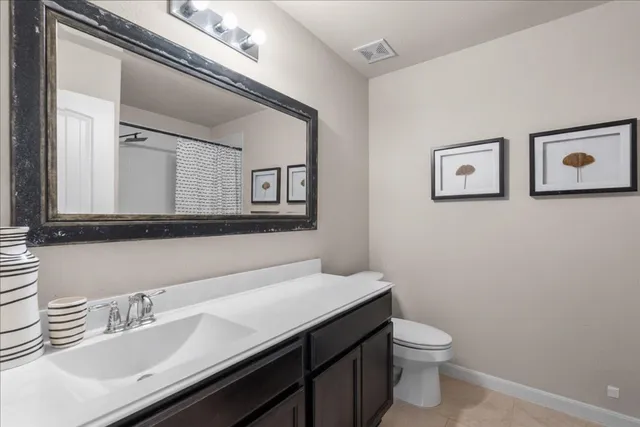 a bedroom with a bed and a television