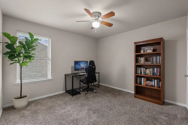 a view of a workspace with furniture