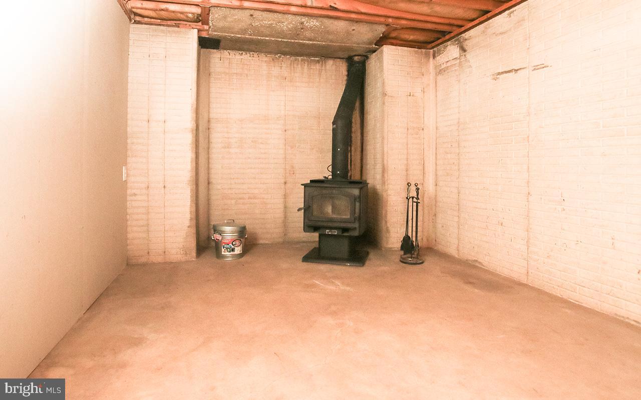 4420 Mt Carmel Road Hampstead, MD 21074 - Photo 34 of 63 Wood stove in basement