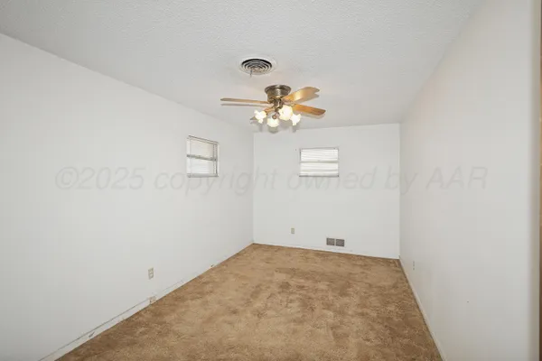 a view of a chandelier fan in a room