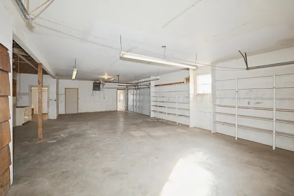 a view of an empty room with windows