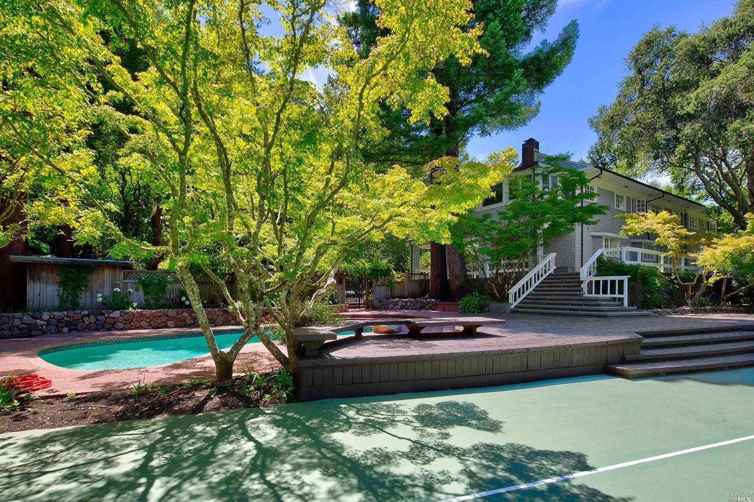 a backyard of a house with lots of green space