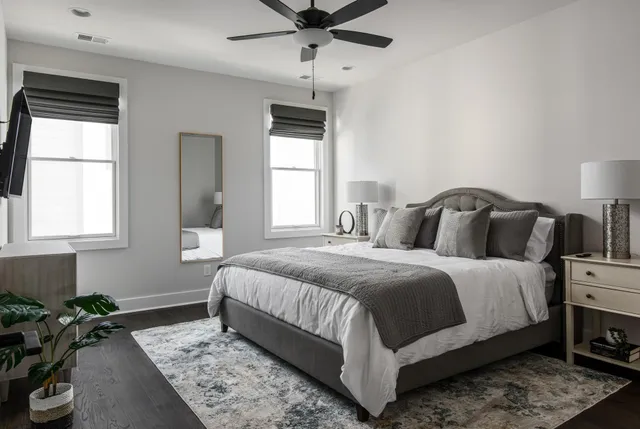 a bedroom with a bed and window