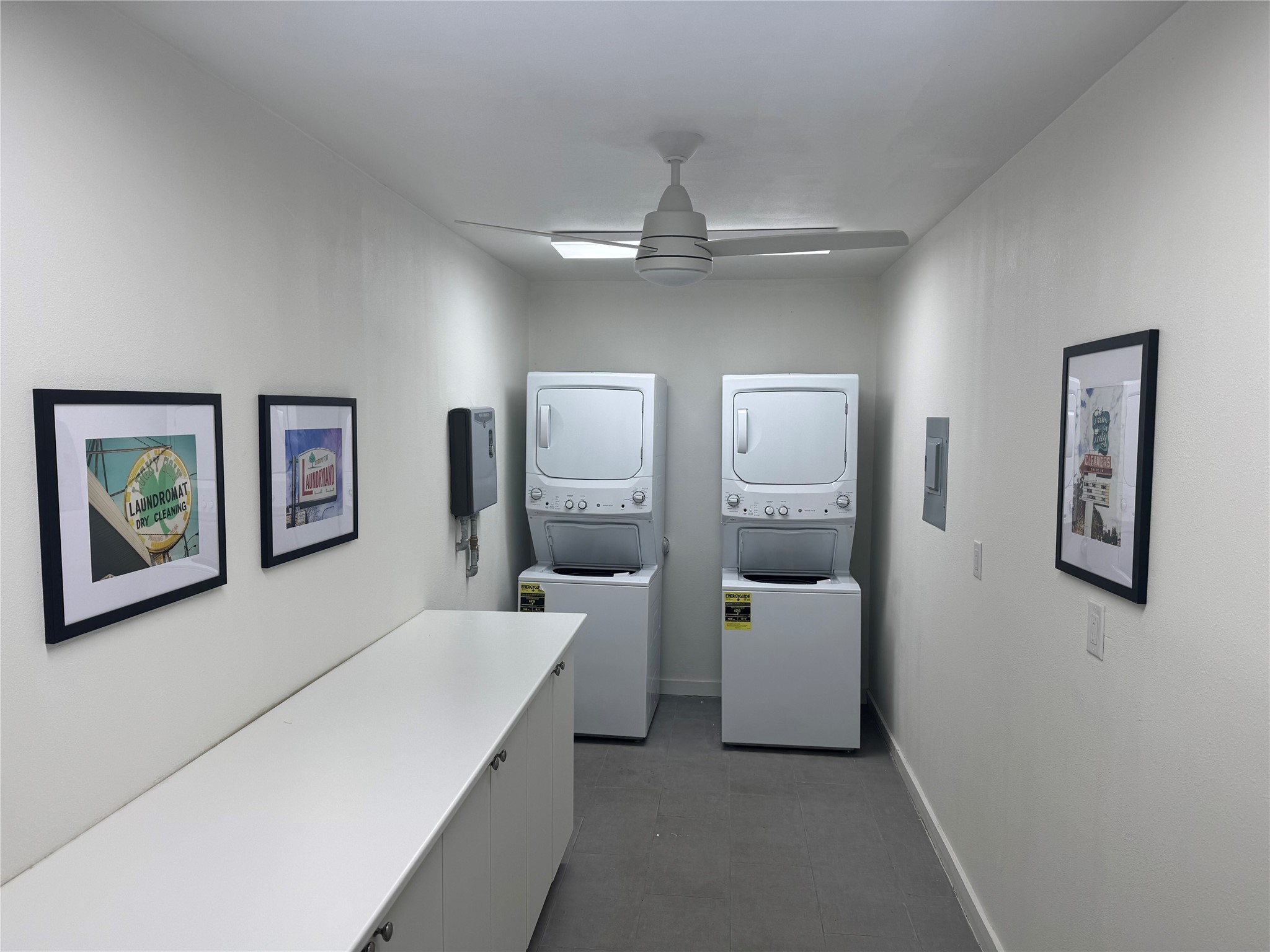 2514 West 12th Street, Unit D Austin, TX 78703 - Photo 9 of 11 a hallway with a white couches chair and wall painting
