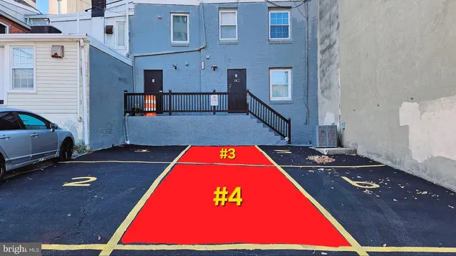 a view of backyard with a table and chairs
