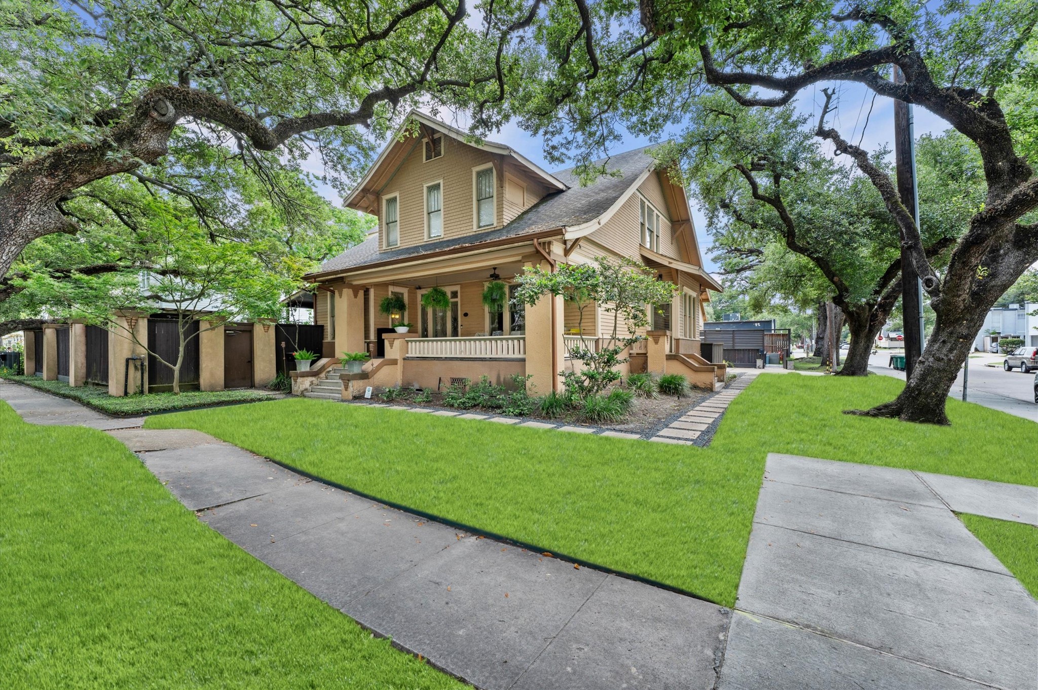 945 Harvard Street Houston, TX 77008 - Photo 10 of 47 a front view of a house with a yard and trees