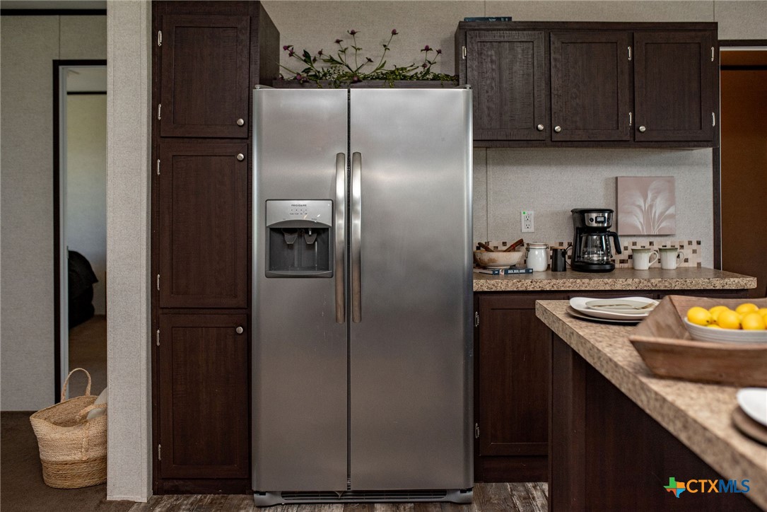 1849 Royal Road Port Lavaca, TX 77979 - Photo 29 of 40 a kitchen with stainless steel appliances granite countertop a refrigerator and a sink