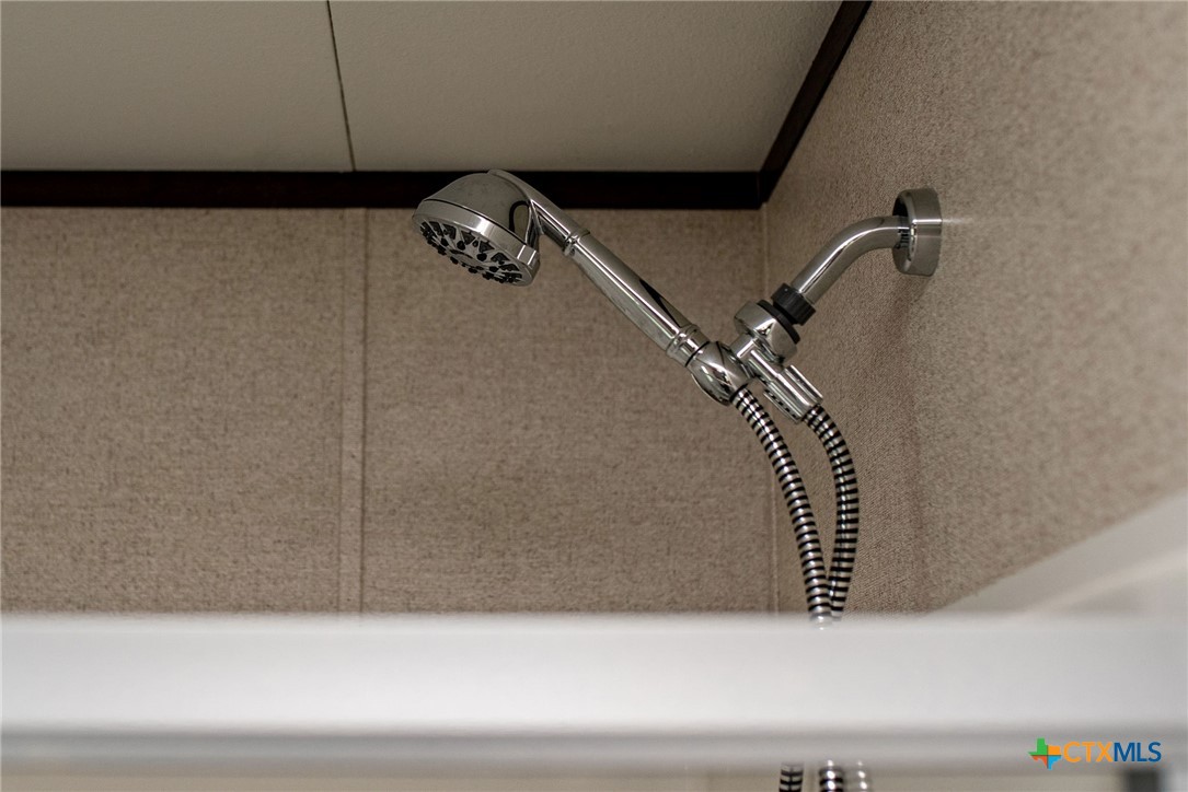 1849 Royal Road Port Lavaca, TX 77979 - Photo 36 of 40 a bathroom with a bathtub and a shower