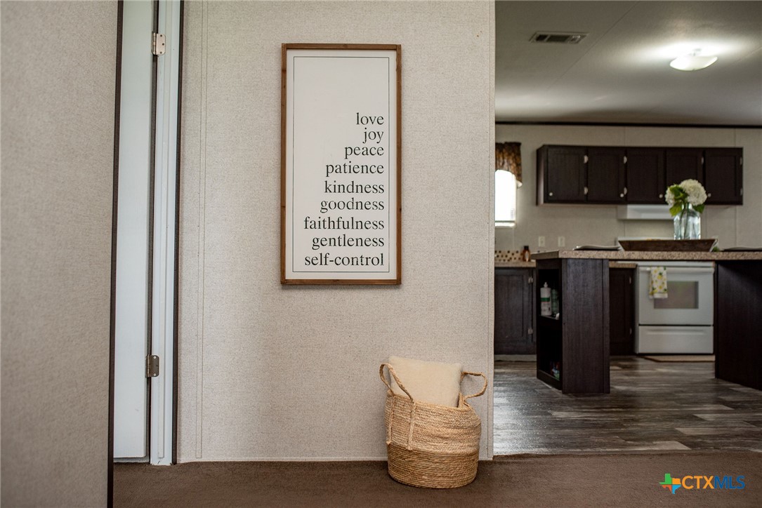 1849 Royal Road Port Lavaca, TX 77979 - Photo 37 of 40 a kitchen with stainless steel appliances granite countertop a stove and a sink