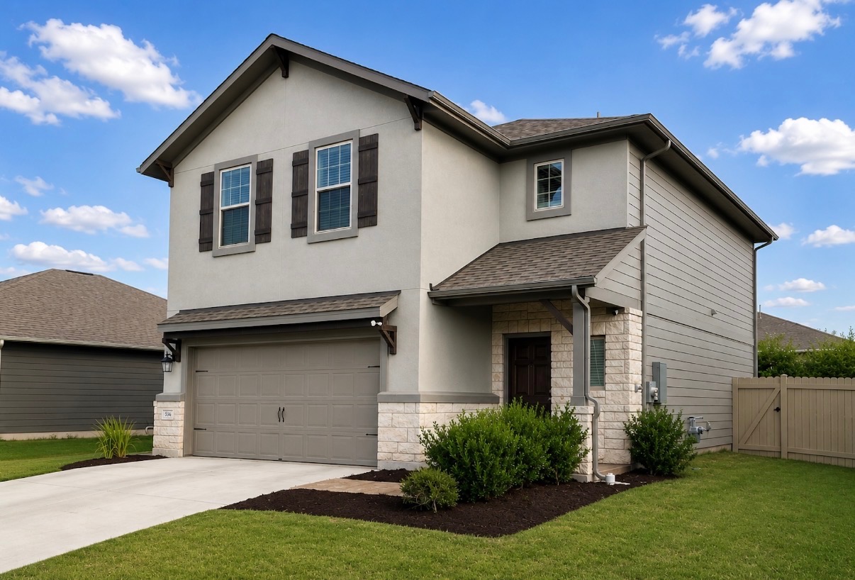 508 Rearing Mare Pass Georgetown, TX 78626 - Photo 2 of 24 A well-maintained two-story residence presents a stone and siding facade with an attached garage.