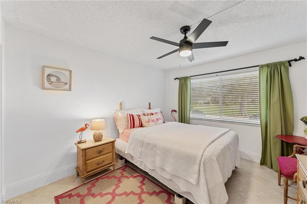 171 Quails Nest Road, Unit 3 Naples, FL 34112 - Photo 19 of 50 a bedroom with a bed and window