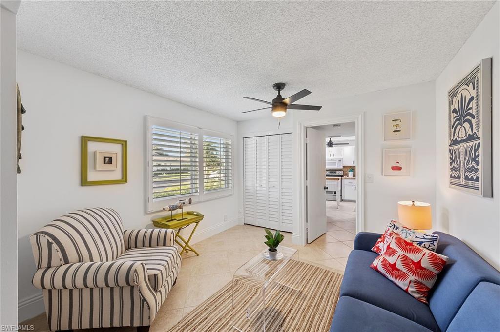 171 Quails Nest Road, Unit 3 Naples, FL 34112 - Photo 27 of 50 a living room with furniture and a window