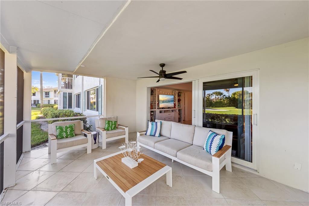 171 Quails Nest Road, Unit 3 Naples, FL 34112 - Photo 33 of 50 a living room with furniture and a rug