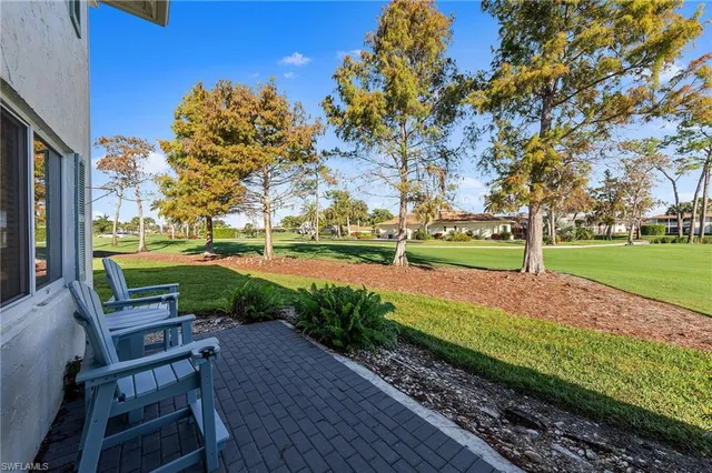 a view of a park with seating space