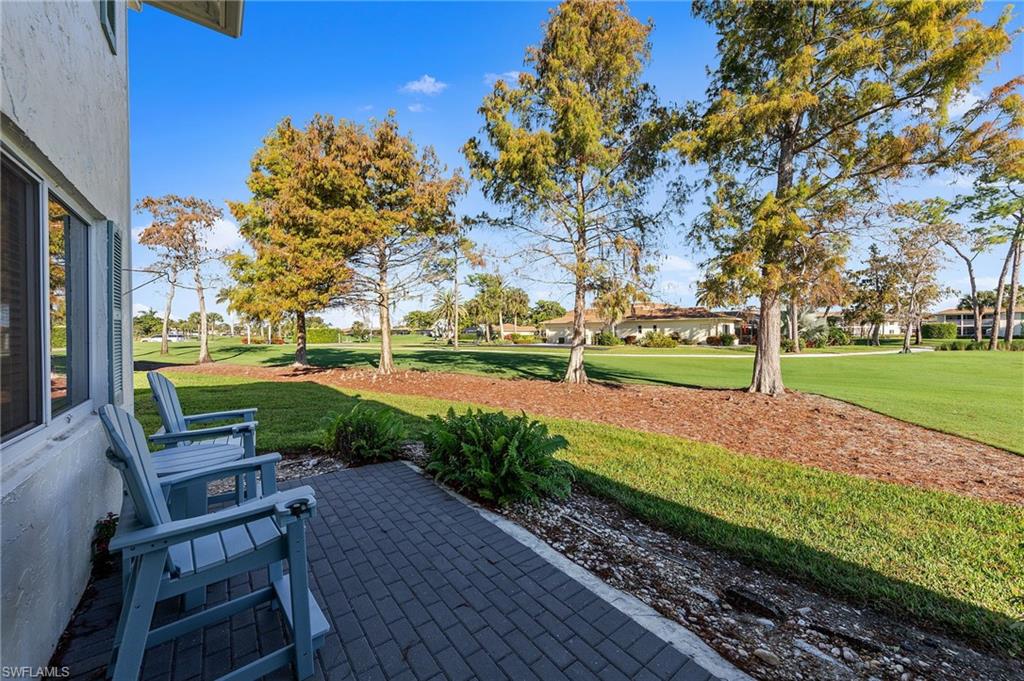 171 Quails Nest Road, Unit 3 Naples, FL 34112 - Photo 34 of 50 a view of a park with seating space