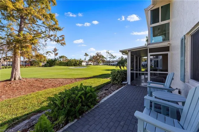a view of an chairs and table in the patio