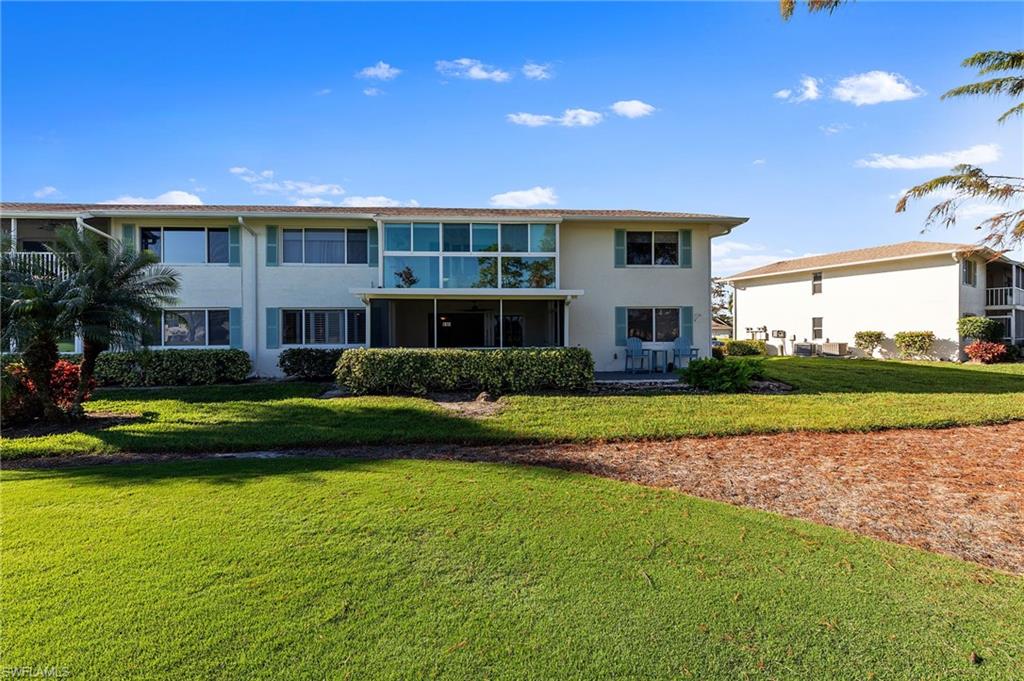 171 Quails Nest Road, Unit 3 Naples, FL 34112 - Photo 38 of 50 a view of a house with a swimming pool