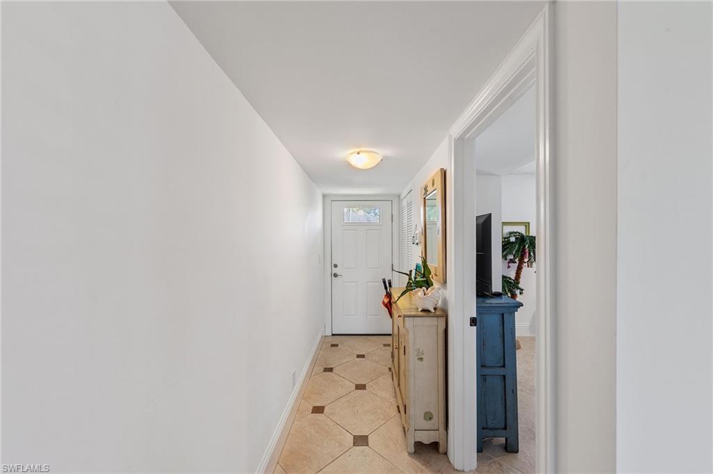 171 Quails Nest Road, Unit 3 Naples, FL 34112 - Photo 4 of 50 a view of a hallway with bathroom and closet