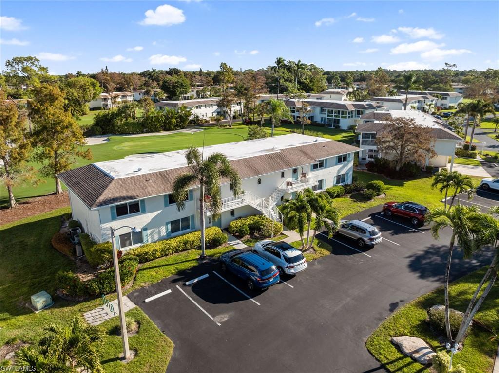 171 Quails Nest Road, Unit 3 Naples, FL 34112 - Photo 41 of 50 a aerial view of a house with yard swimming pool and outdoor seating