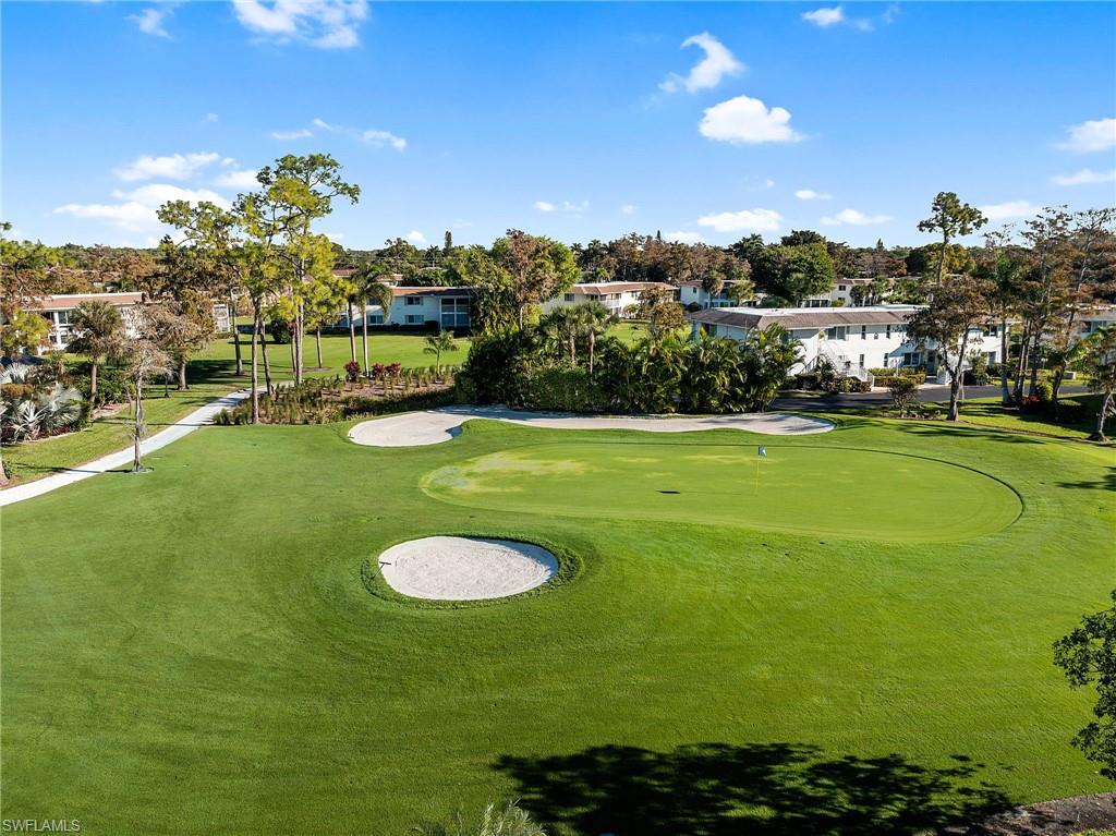 171 Quails Nest Road, Unit 3 Naples, FL 34112 - Photo 43 of 50 a view of a golf course with a swimming pool
