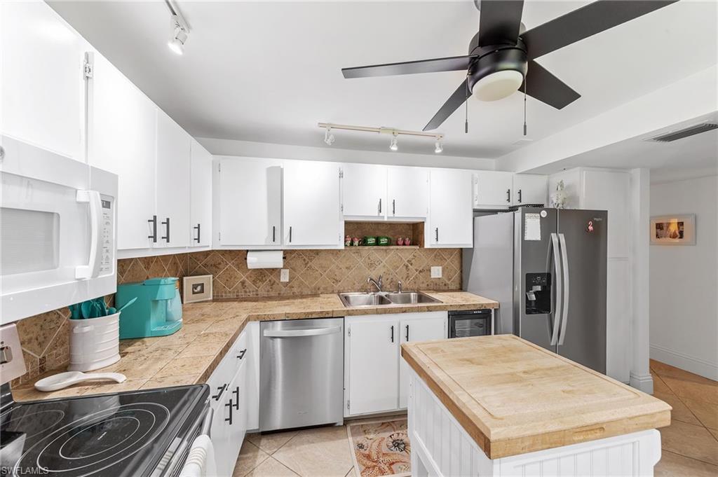 171 Quails Nest Road, Unit 3 Naples, FL 34112 - Photo 8 of 50 a kitchen with a sink a stove and refrigerator