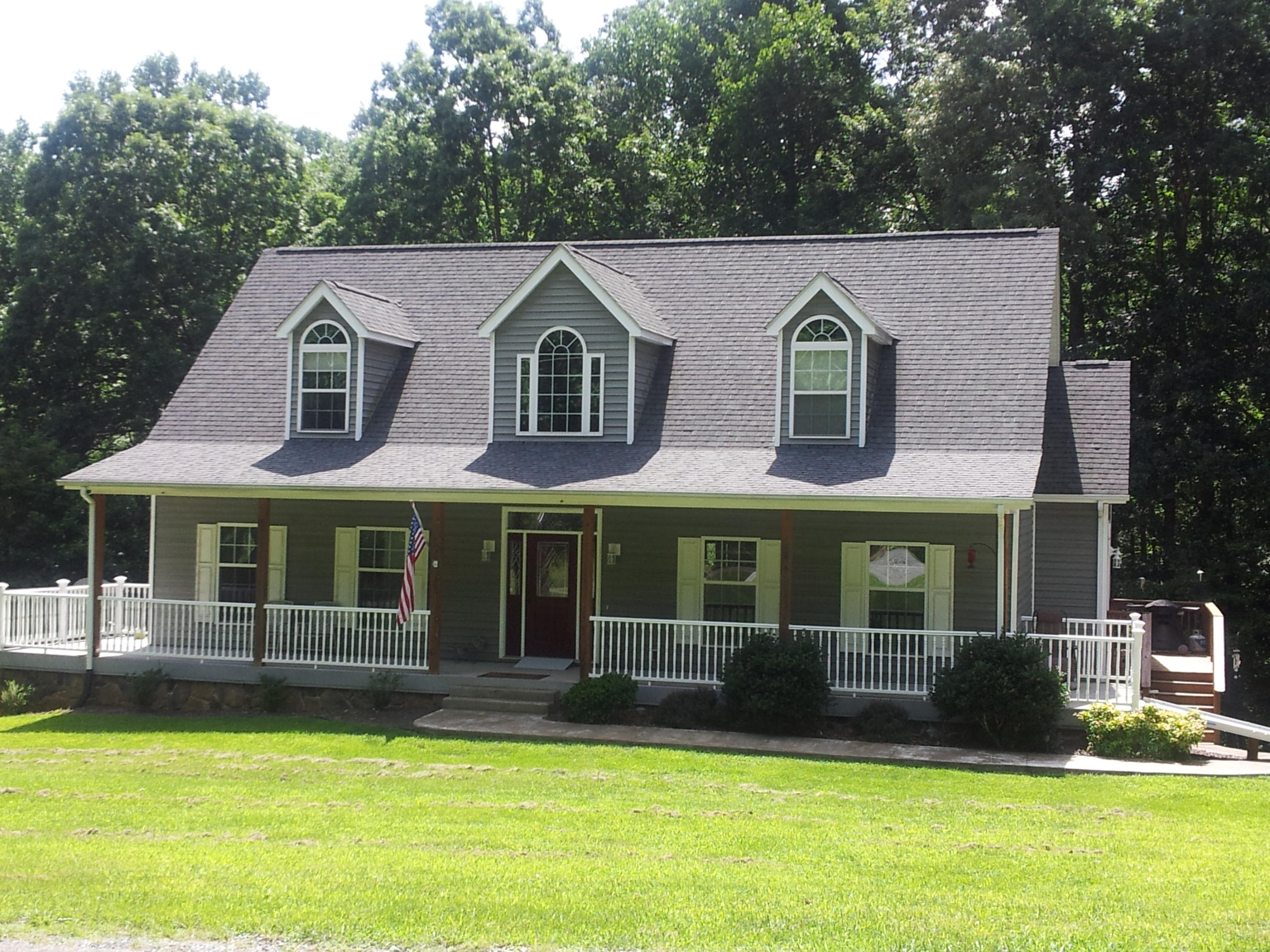 4412 Roaring Run Road Goode, VA 24556 - Photo 1 of 6 a front view of a house with a yard