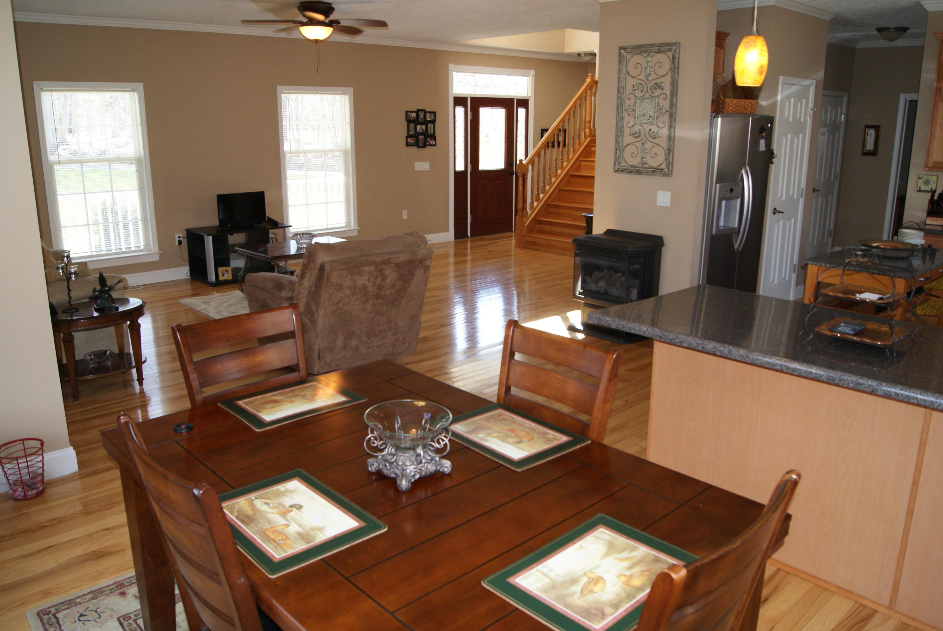 4412 Roaring Run Road Goode, VA 24556 - Photo 2 of 6 a living room with furniture and a flat screen tv