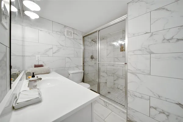 a bathroom with a bathtub and shower