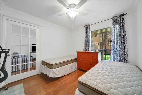 a bedroom with furniture and a window