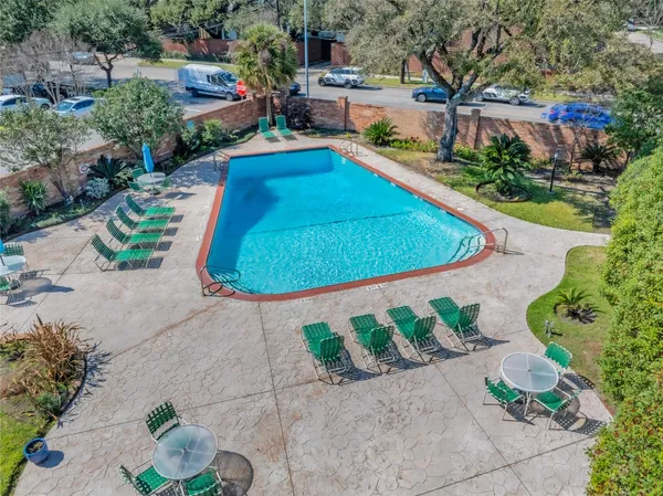 a view of a backyard with plants and lake view