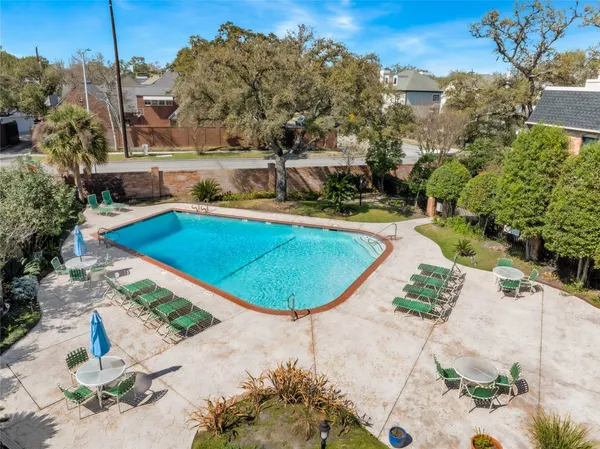 a view of a swimming pool with a yard