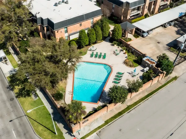 an aerial view of a house with outdoor space and street view