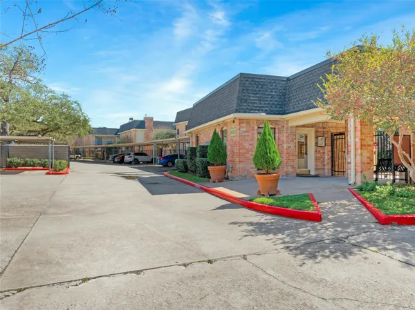 a view of street with tall buildings