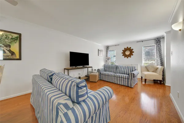 a bedroom with a bed and a television