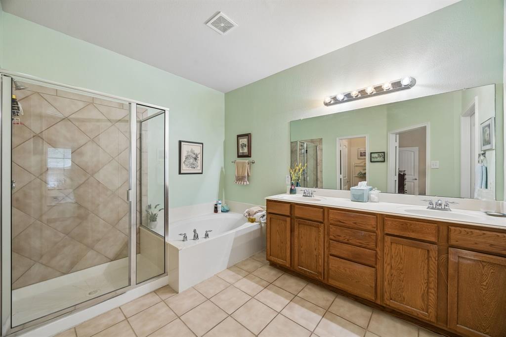2003 Downing Street Allen, TX 75013 - Photo 24 of 40 And now the AMAZING primary ensuite, complete with double sinks - lots of storage - inviting soaking tub - and large separate shower!