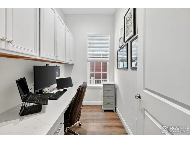 a view of a workspace with furniture