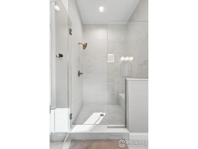 a bedroom with a bed window and couch