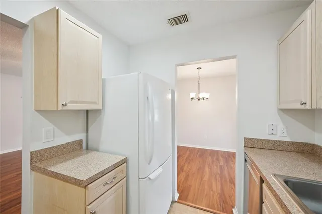 a kitchen that has a sink and a stove