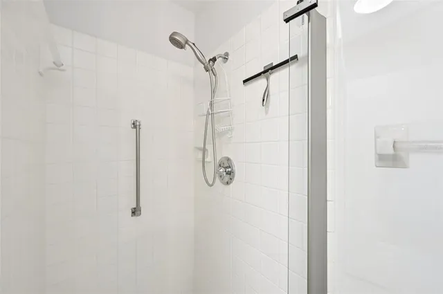 an empty room with a ceiling fan and a window