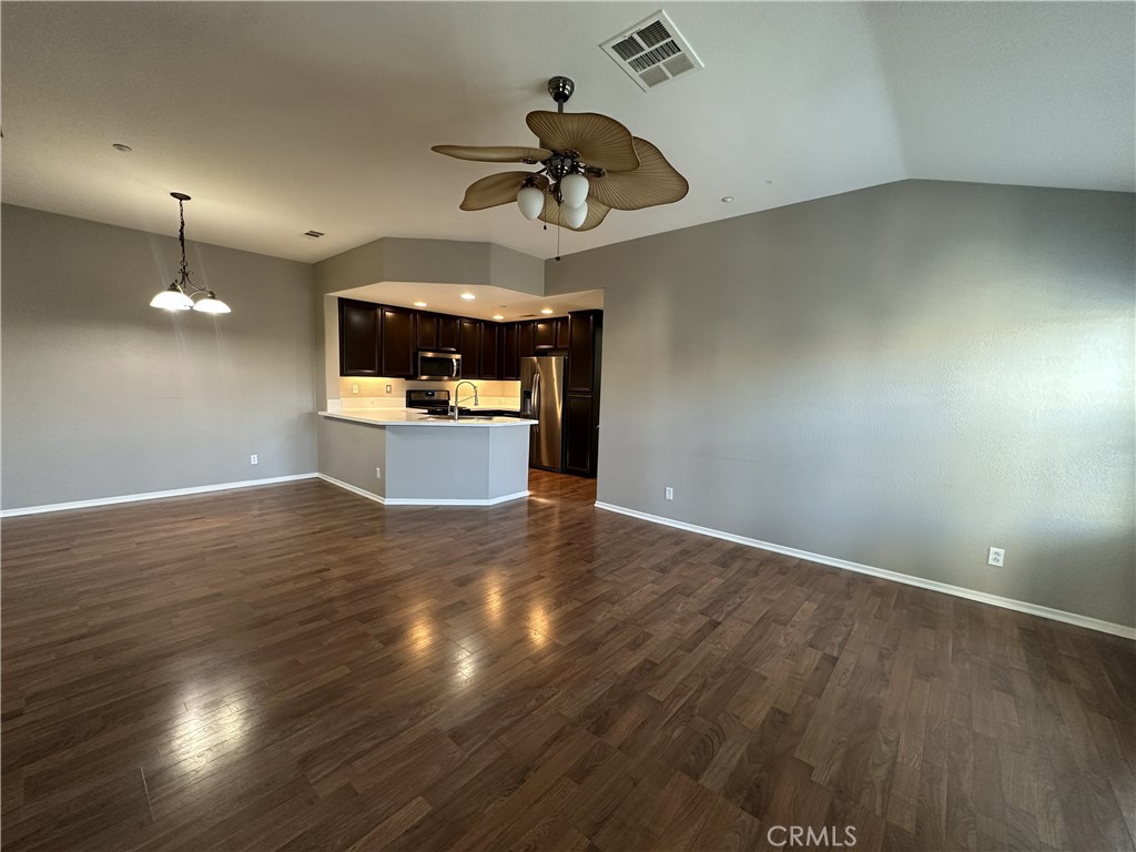 25190 Crest Haven Street, Unit 2 Murrieta, CA 92562 - Photo 14 of 30 a view of kitchen and hall with wooden floor