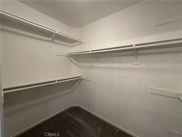 a view of an empty walk in closet