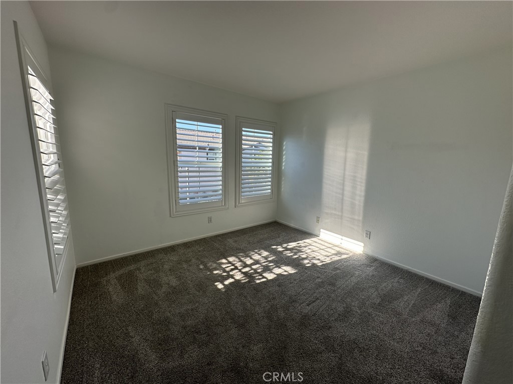 25190 Crest Haven Street, Unit 2 Murrieta, CA 92562 - Photo 26 of 30 a view of an empty room and window
