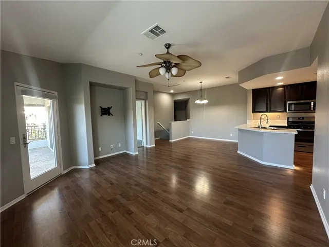a view of kitchen with cabinets and wooden floor