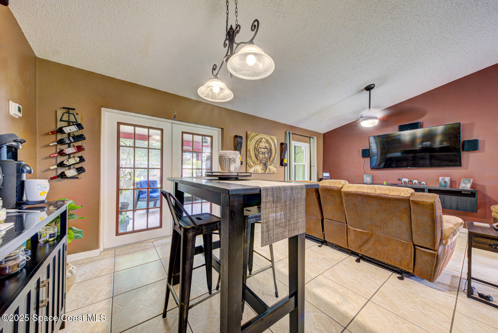 5370 Holden Road Cocoa, FL 32927 - Photo 12 of 38 dining room with doors to porch