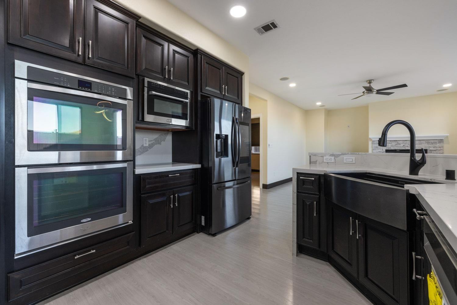 5106 Watkings Way Antioch, CA 94531 - Photo 18 of 50 a kitchen with stainless steel appliances granite countertop a stove and a microwave