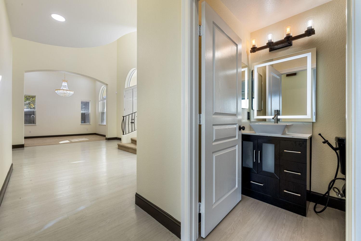 5106 Watkings Way Antioch, CA 94531 - Photo 26 of 50 a view of a hallway with bathroom and mirror