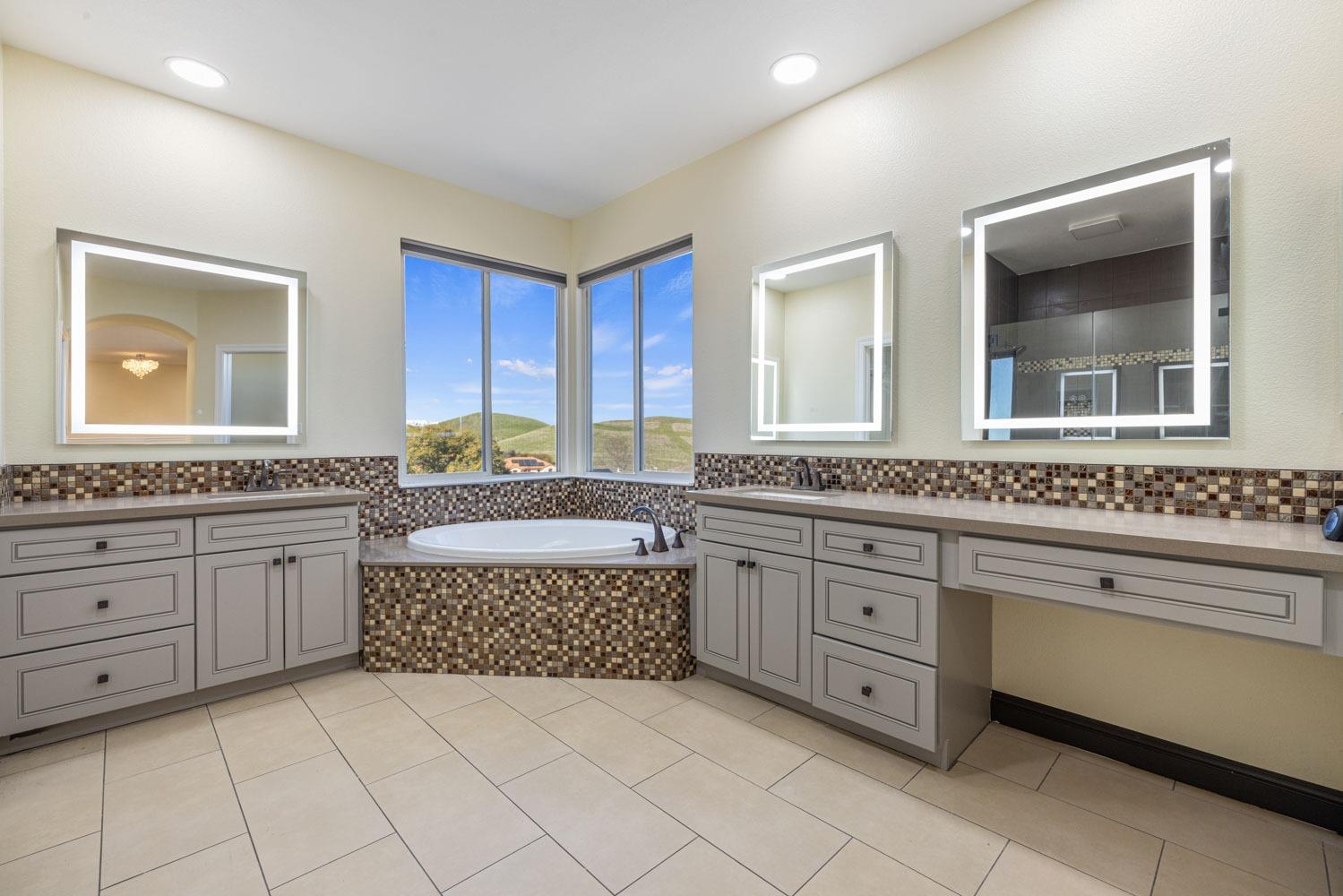 5106 Watkings Way Antioch, CA 94531 - Photo 43 of 50 a spacious bathroom with a granite countertop sink and mirror