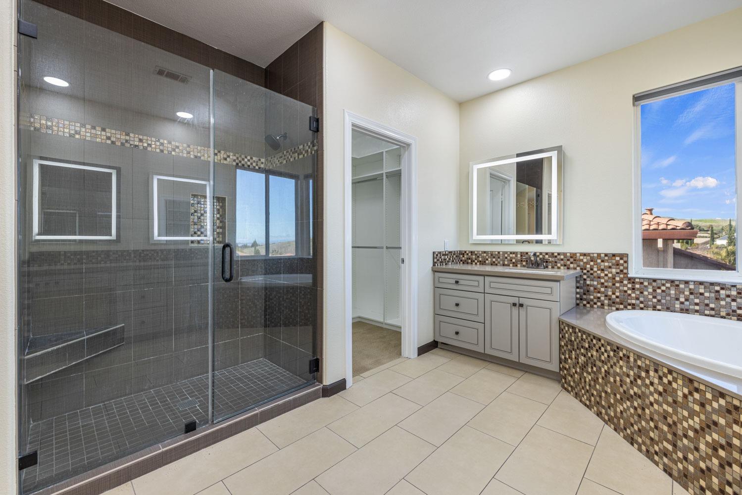 5106 Watkings Way Antioch, CA 94531 - Photo 44 of 50 a bathroom with a granite countertop sink a toilet a mirror and shower