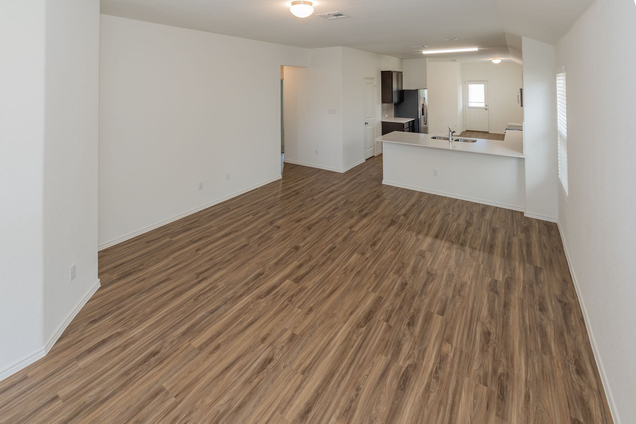 509 Greatest Gift Way Jarrell, TX 76537 - Photo 5 of 28 a view of kitchen and wooden floor